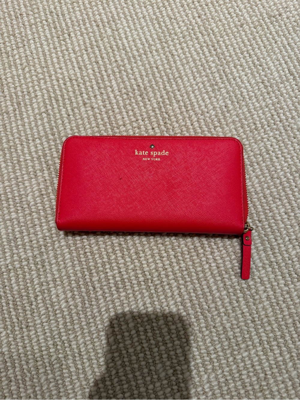 kate spade New York red zip-around saffiano leather wallet